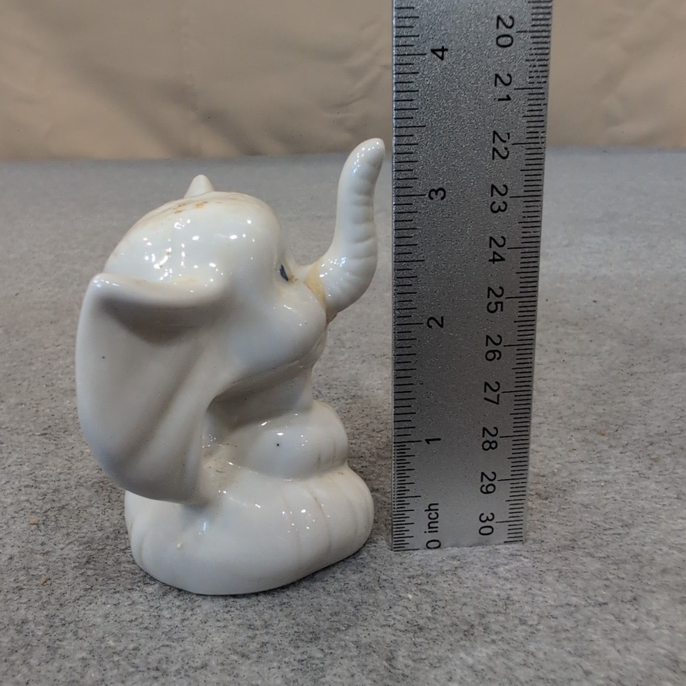 Vintage White Ceramic Elephant Figurine Seated Trunk Up Blue Eyes Bow Tie - Picture 2 of 4